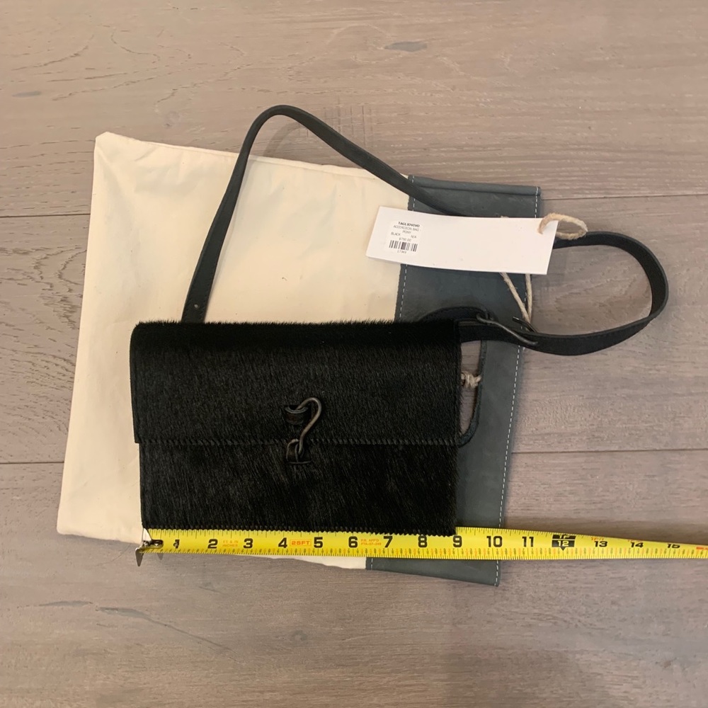 Pony hair black brown purse. By TAGLIOVIVO